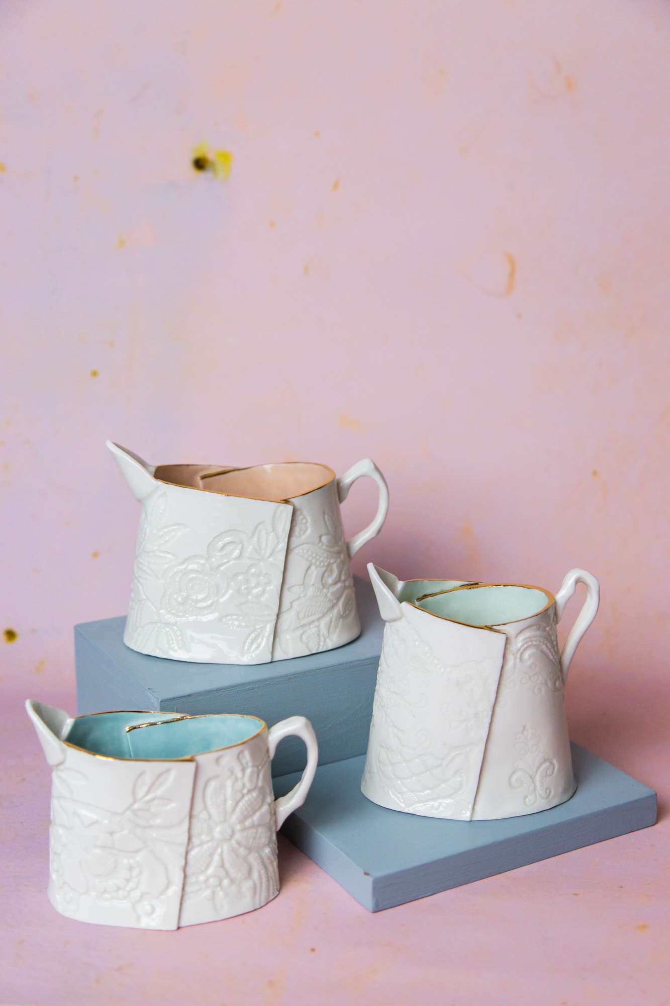 Lace Printed Jugs. Porcelain with pastel glazes and gold lustre accents. Sizes range from 10-15cm high