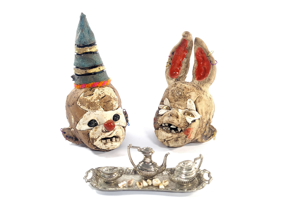 Tea and Teeth? Heads, the size of a large orange with hats, Stoneware ceramics