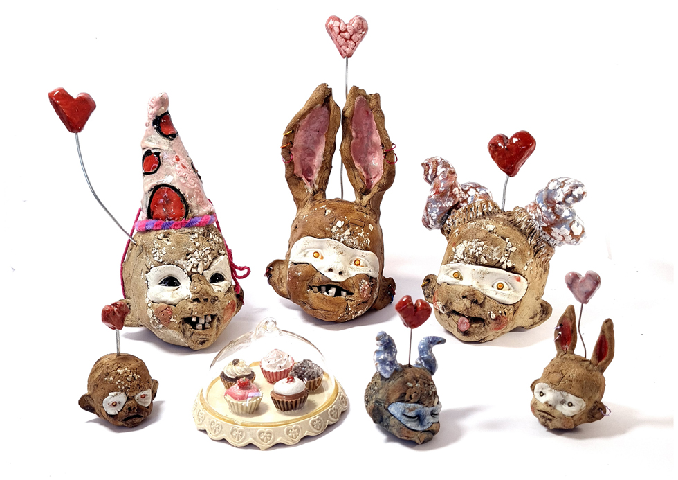 Love is in the air, a range of heads, the size of a large orange to plumbs, Stoneware ceramics