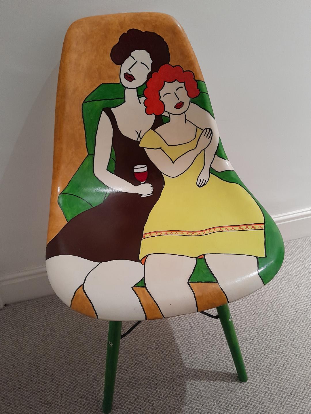 2 girls on green sofa. Acrylic paint on plastic chair.