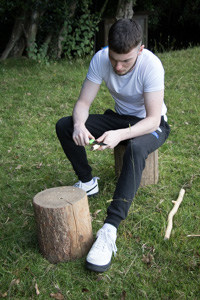 " I'm using a bushcraft knife and learnt the safe ways to use it. In the picture I'm whittling and making a 'Wizard's Wand'. I sharpened a point and made designs in the bark. I wished I could have stayed all day."