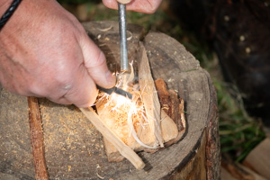 "The picture shows me lighting a fire bushcraft style. The spark or ignition came from a Fire Striker which is a magnesium rod and steel striker. I made tinder from pine sap wood, kindling was Ash which burns really well. It was exciting and a fantastic sense of achievement. "